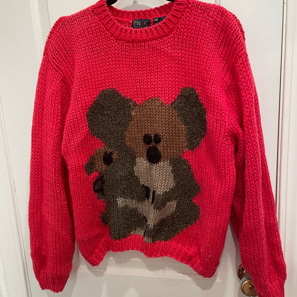 Gently Used Koala Bear Sweater. Color is Red, Brown and Black.